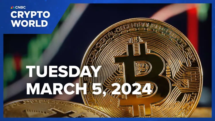 Bitcoin rises to record above $69,000, then quickly tumbles 8%